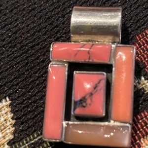 Beautiful pink coral .75” x 1.25” sterling silver pendant